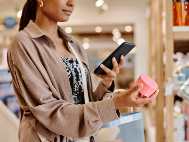 A beauty customer researching products in-store