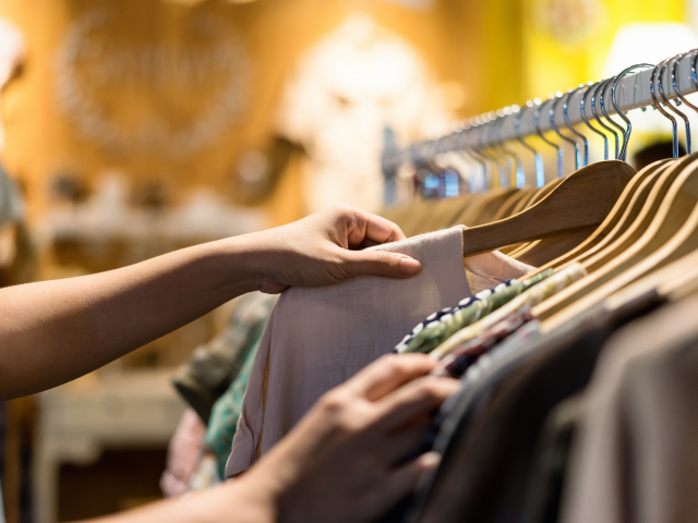 retail sales associate organizing merchandise